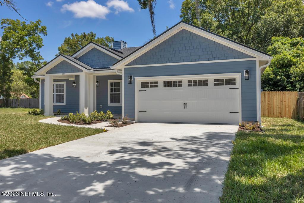 1281 Glen Laura Road Jacksonville, FL 32205 - Photo 2 of 33 a front view of a house with a yard and garage