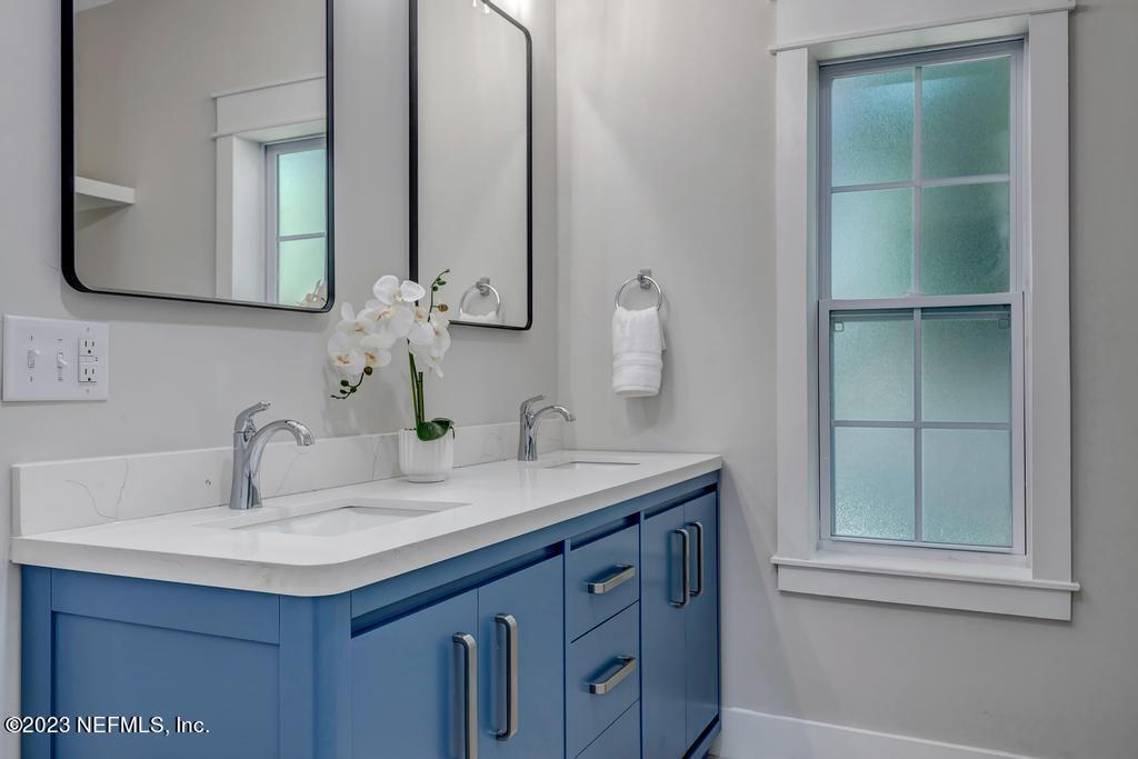 1281 Glen Laura Road Jacksonville, FL 32205 - Photo 22 of 33 a bathroom with a sink and a mirror