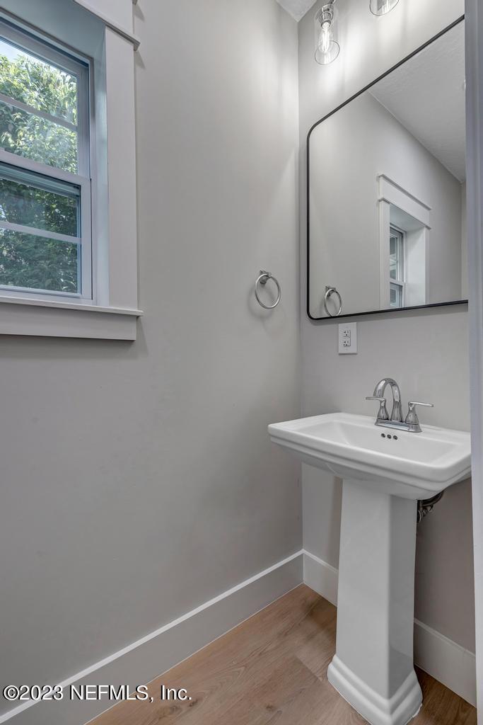 1281 Glen Laura Road Jacksonville, FL 32205 - Photo 23 of 33 a bathroom with a sink a vanity and a mirror