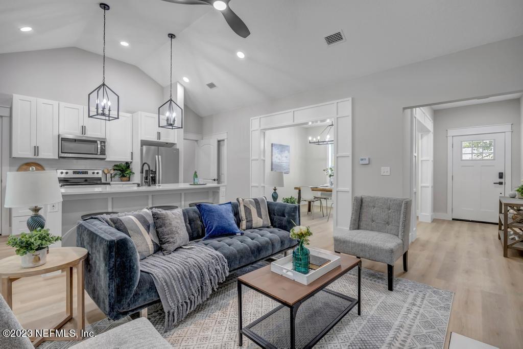 1281 Glen Laura Road Jacksonville, FL 32205 - Photo 4 of 33 a view of living room kitchen with furniture and wooden floor