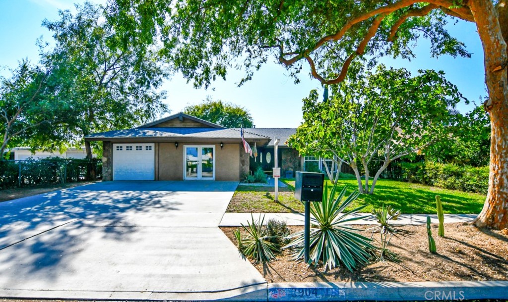 3904 Burge Street Riverside, CA 92505 - Photo 1 of 1 a front view of a house with a yard and potted plants