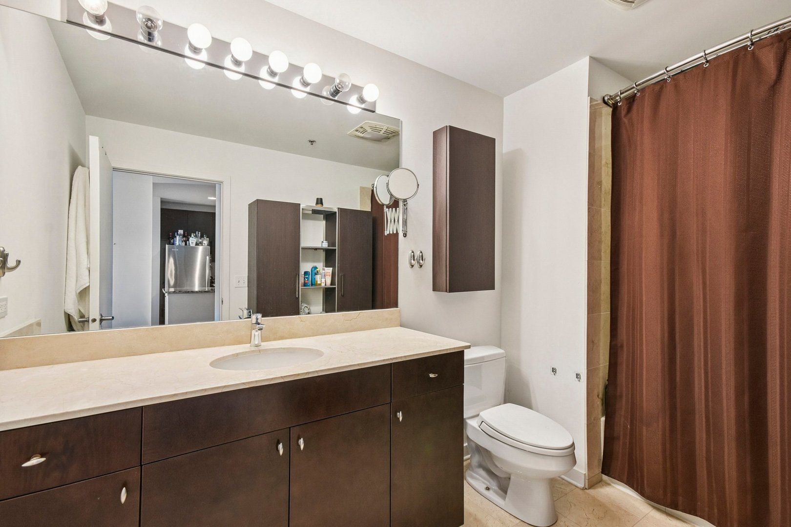 303 West Ohio Street, Unit 3309 Chicago, IL 60654 - Photo 15 of 23 a bathroom with a sink vanity granite and toilet