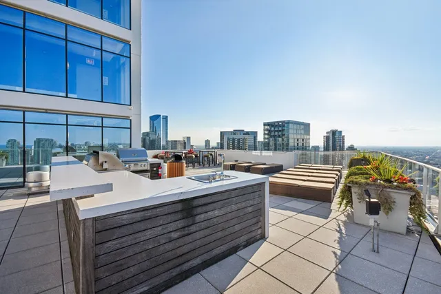a room with furniture a rug and white walls
