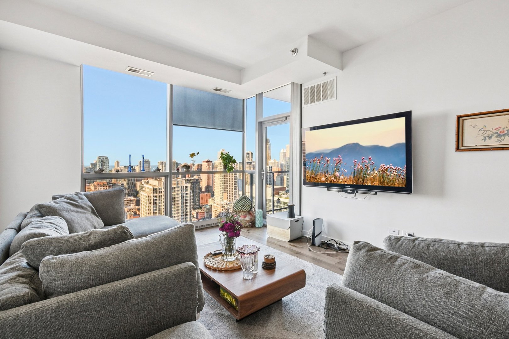 303 West Ohio Street, Unit 3309 Chicago, IL 60654 - Photo 7 of 23 a living room with furniture and a view of kitchen