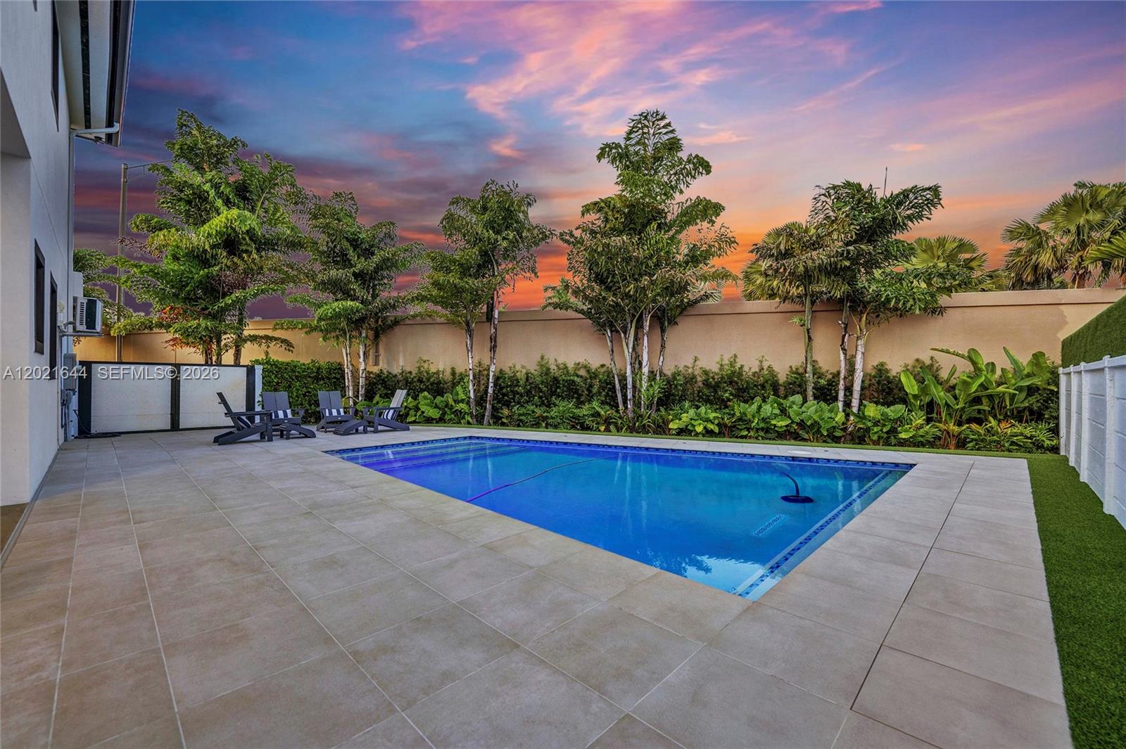 7800 Southwest 9th Terrace Miami, FL 33144 - Photo 4 of 64 a view of swimming pool with outdoor seating and plants