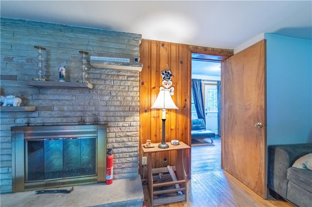 221 Hartzell School Road Fombell, PA 16123 - Photo 12 of 40 a view of a livingroom with furniture and wooden floor