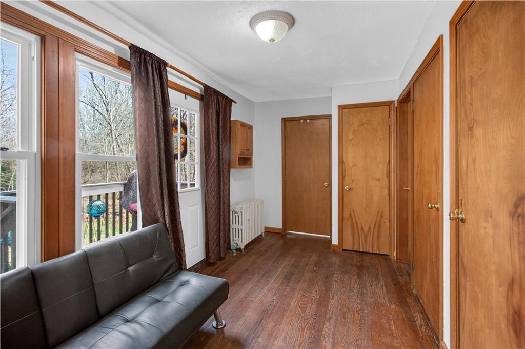 221 Hartzell School Road Fombell, PA 16123 - Photo 13 of 40 a view of livingroom with furniture and wooden floor