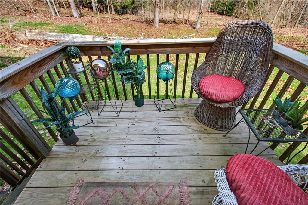 221 Hartzell School Road Fombell, PA 16123 - Photo 16 of 40 a view of a chairs with flower pot