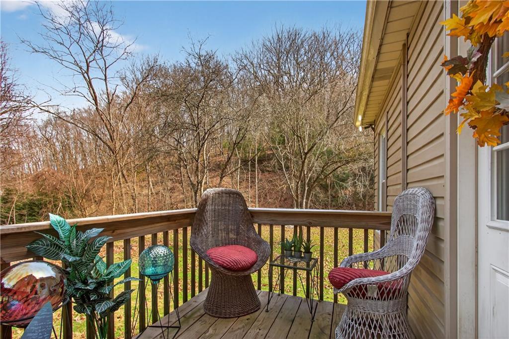 221 Hartzell School Road Fombell, PA 16123 - Photo 17 of 40 a view of a balcony with wooden floor