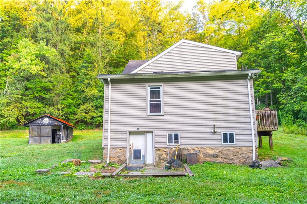 221 Hartzell School Road Fombell, PA 16123 - Photo 30 of 40 a front view of house with yard and green space