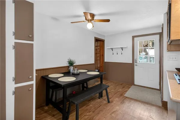 a view of a livingroom with furniture and wooden floor