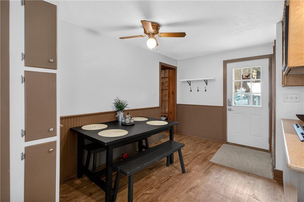 221 Hartzell School Road Fombell, PA 16123 - Photo 3 of 40 a view of a livingroom with furniture and wooden floor