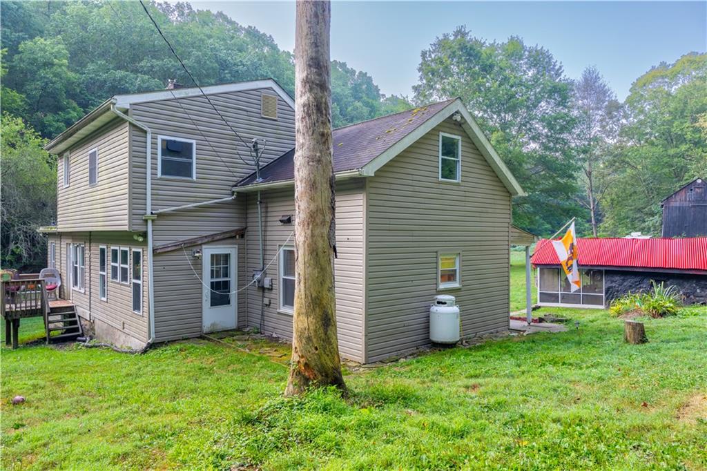 221 Hartzell School Road Fombell, PA 16123 - Photo 31 of 40 a view of a house with backyard