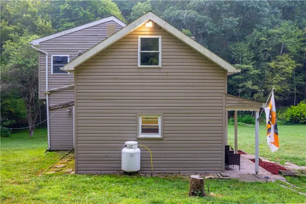 a backyard of a house with seating space