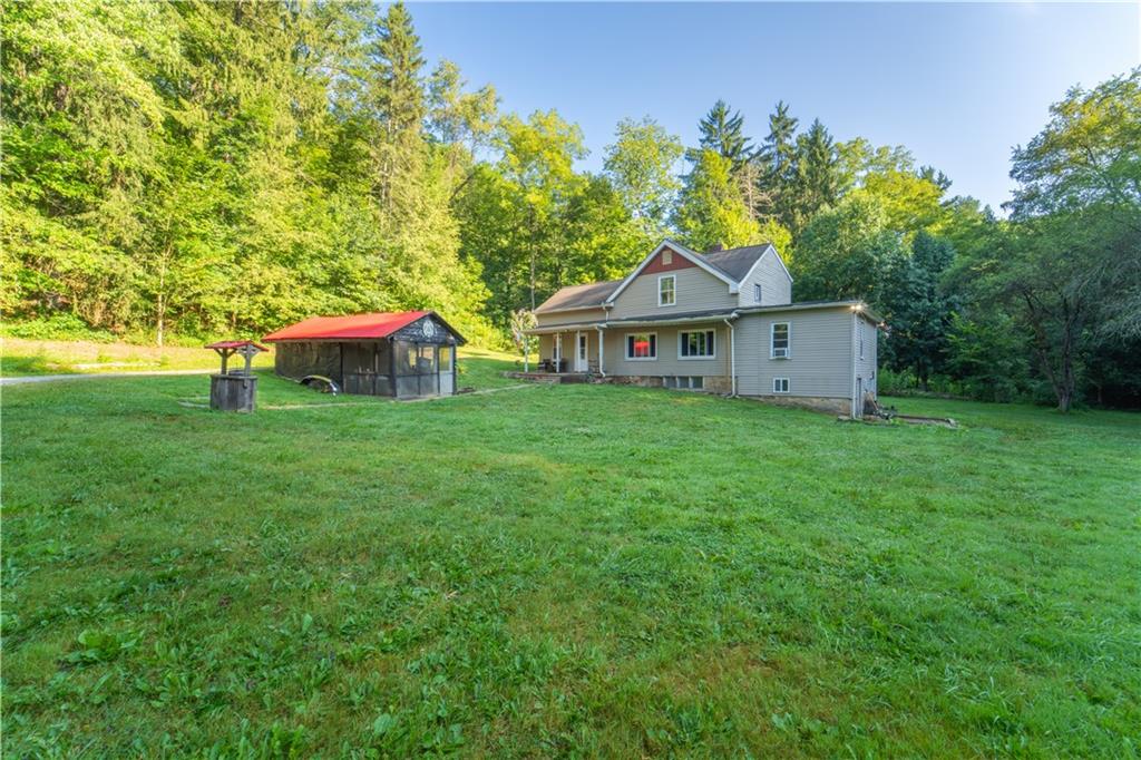 221 Hartzell School Road Fombell, PA 16123 - Photo 33 of 40 a view of a house with a backyard