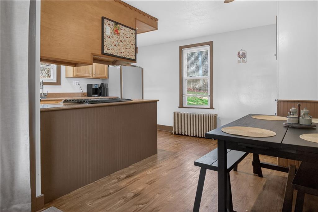 221 Hartzell School Road Fombell, PA 16123 - Photo 4 of 40 a room with a table and chairs