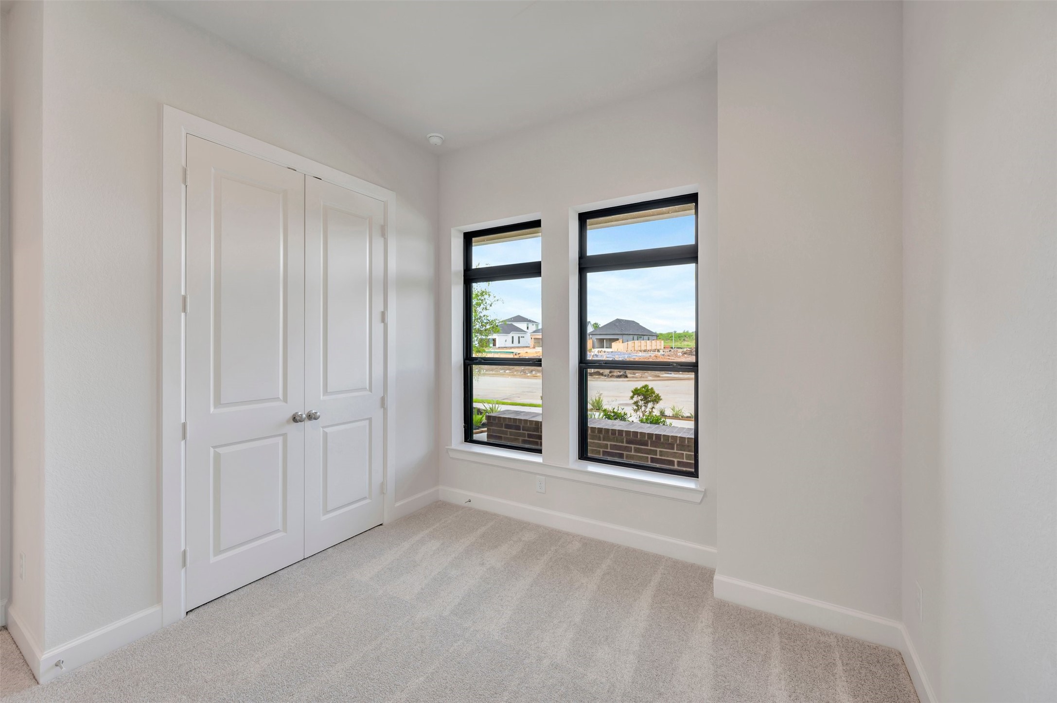2718 Cottage Place Rosharon, TX 77583 - Photo 17 of 50 a view of an empty room with a window