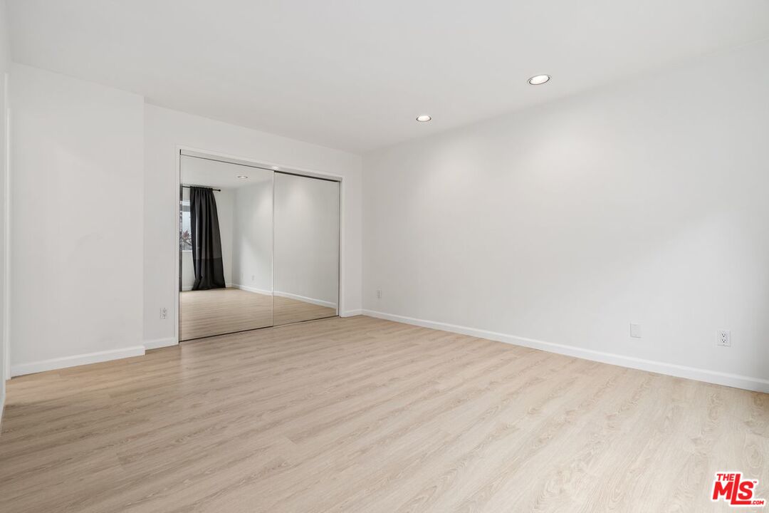 3135 Chandelle Road Los Angeles, CA 90046 - Photo 15 of 29 a view of an empty room with wooden floor