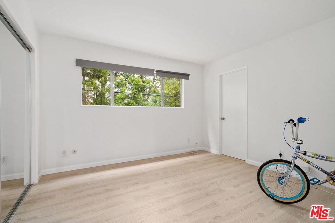 3135 Chandelle Road Los Angeles, CA 90046 - Photo 18 of 29 a view of an empty room with a window