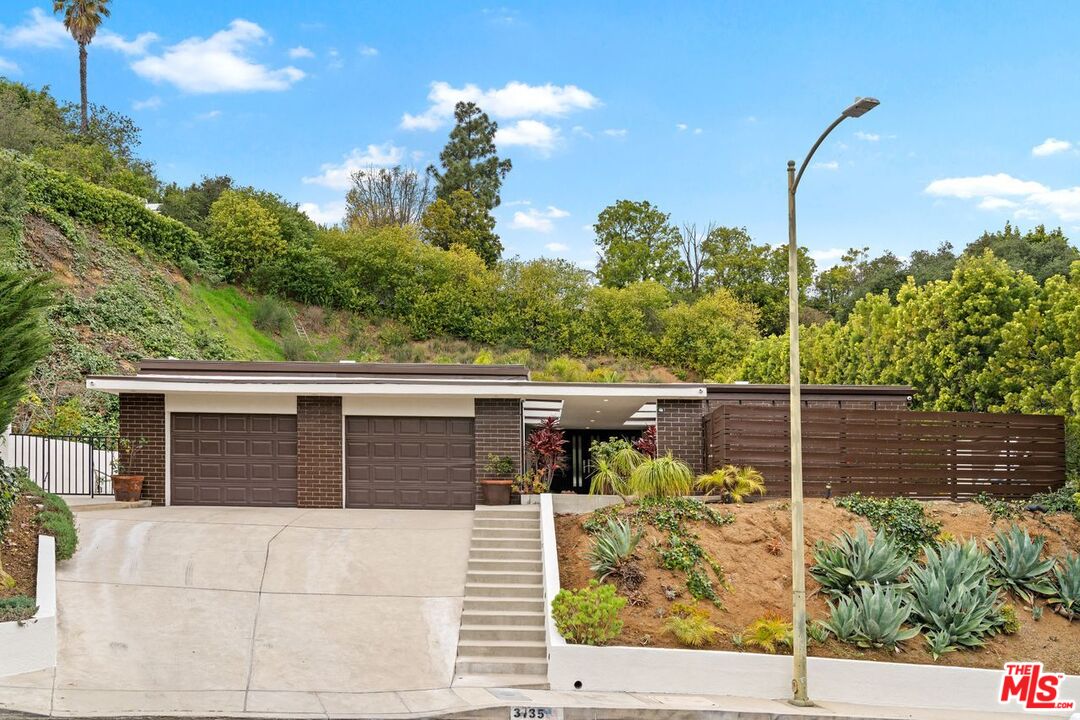 3135 Chandelle Road Los Angeles, CA 90046 - Photo 2 of 29 a view of a balcony with chairs