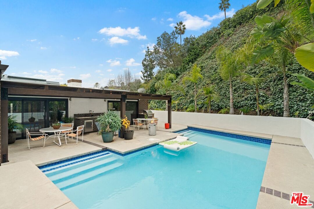 3135 Chandelle Road Los Angeles, CA 90046 - Photo 27 of 29 a view of pool table and chairs in patio