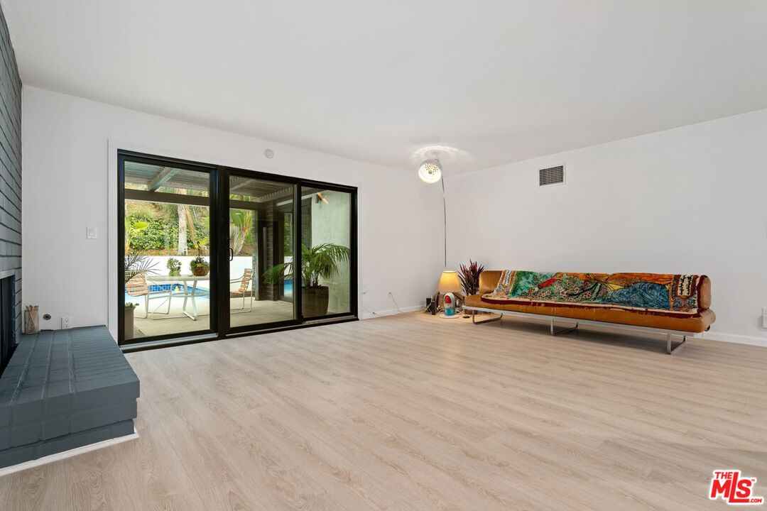 3135 Chandelle Road Los Angeles, CA 90046 - Photo 5 of 29 a view of a room with furniture and large windows