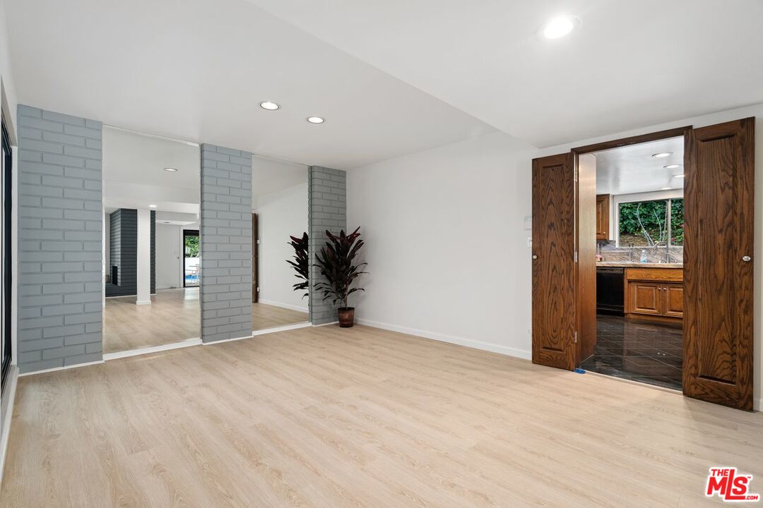 3135 Chandelle Road Los Angeles, CA 90046 - Photo 8 of 29 a view of an empty room with glass door