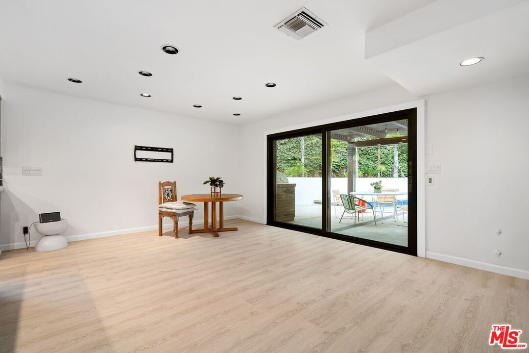 3135 Chandelle Road Los Angeles, CA 90046 - Photo 9 of 29 a view of a livingroom with furniture and floor to ceiling window