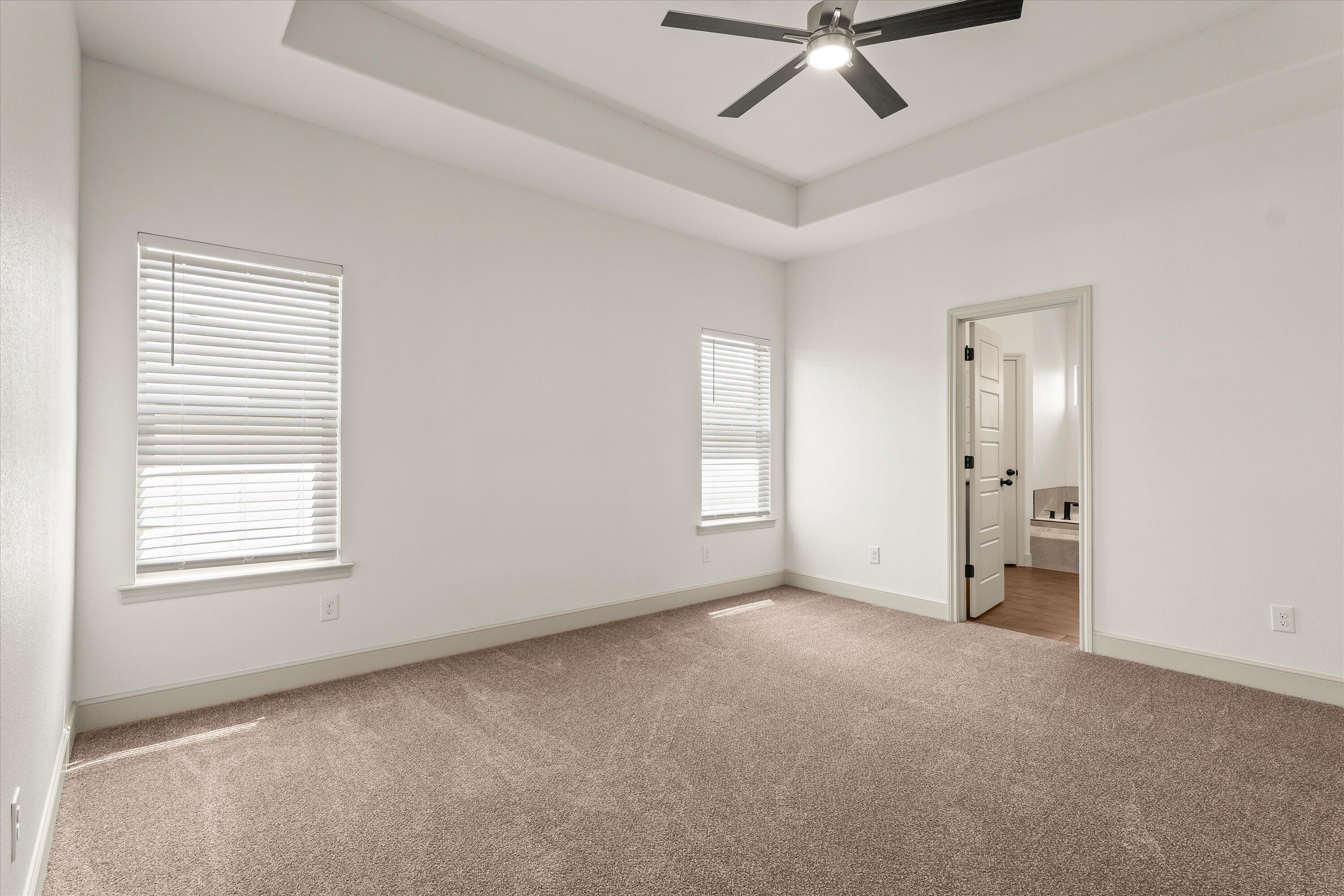 5719 116th Street Lubbock, TX 79424 - Photo 12 of 31 a view of an empty room with a window