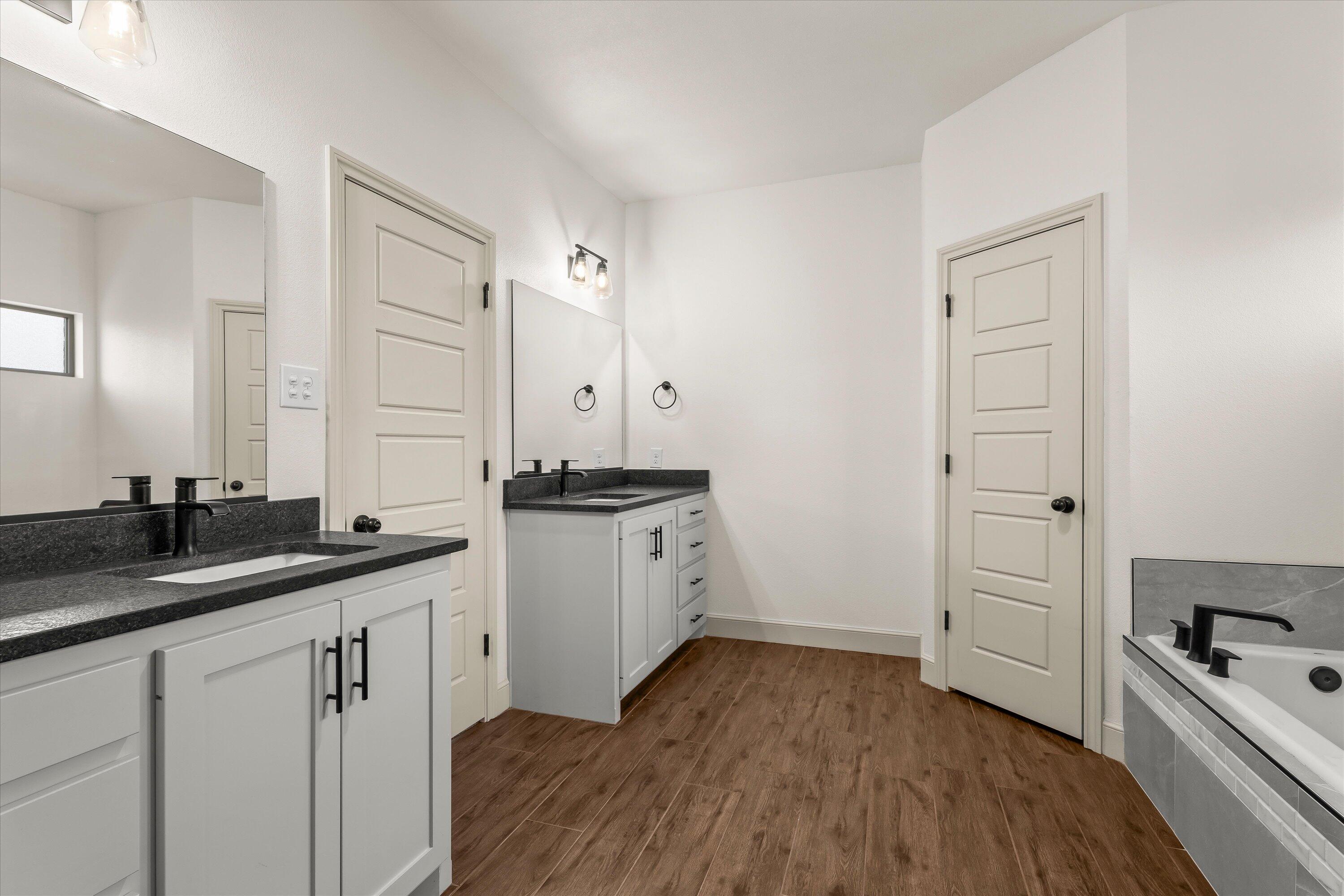 5719 116th Street Lubbock, TX 79424 - Photo 15 of 31 a kitchen with a sink stove and cabinets