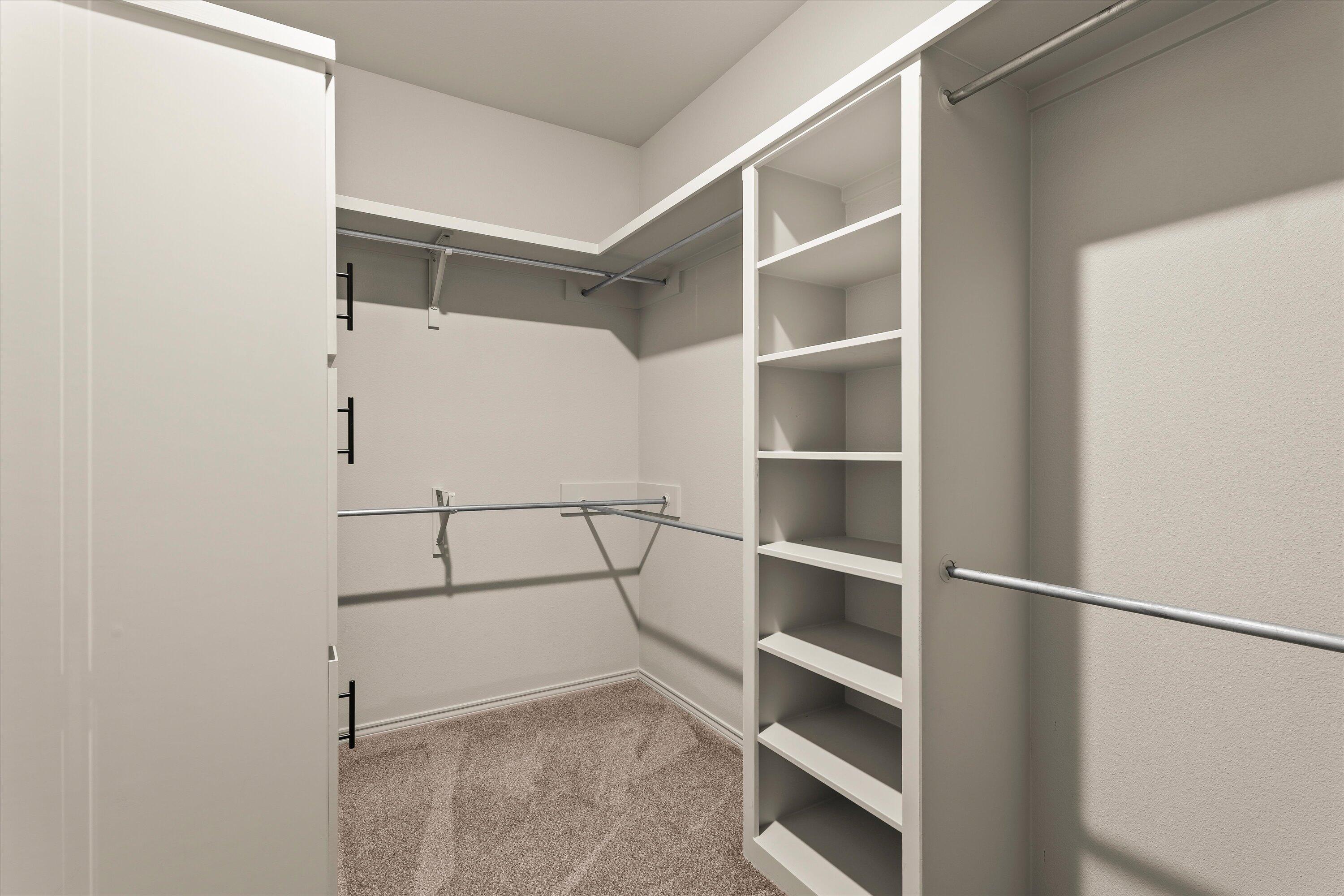 5719 116th Street Lubbock, TX 79424 - Photo 18 of 31 a view of an empty walk in closet