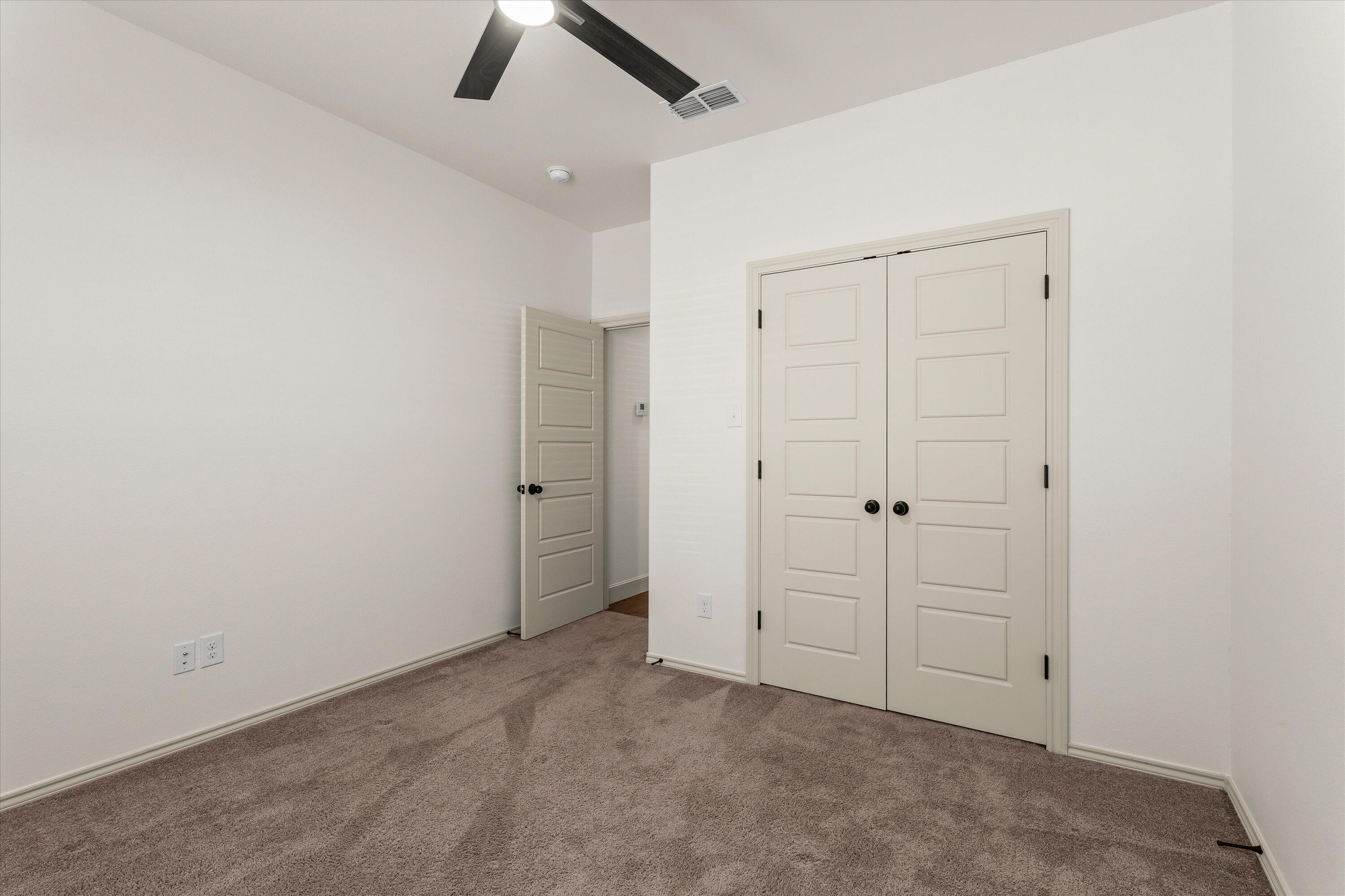 5719 116th Street Lubbock, TX 79424 - Photo 20 of 31 an empty room with closet area