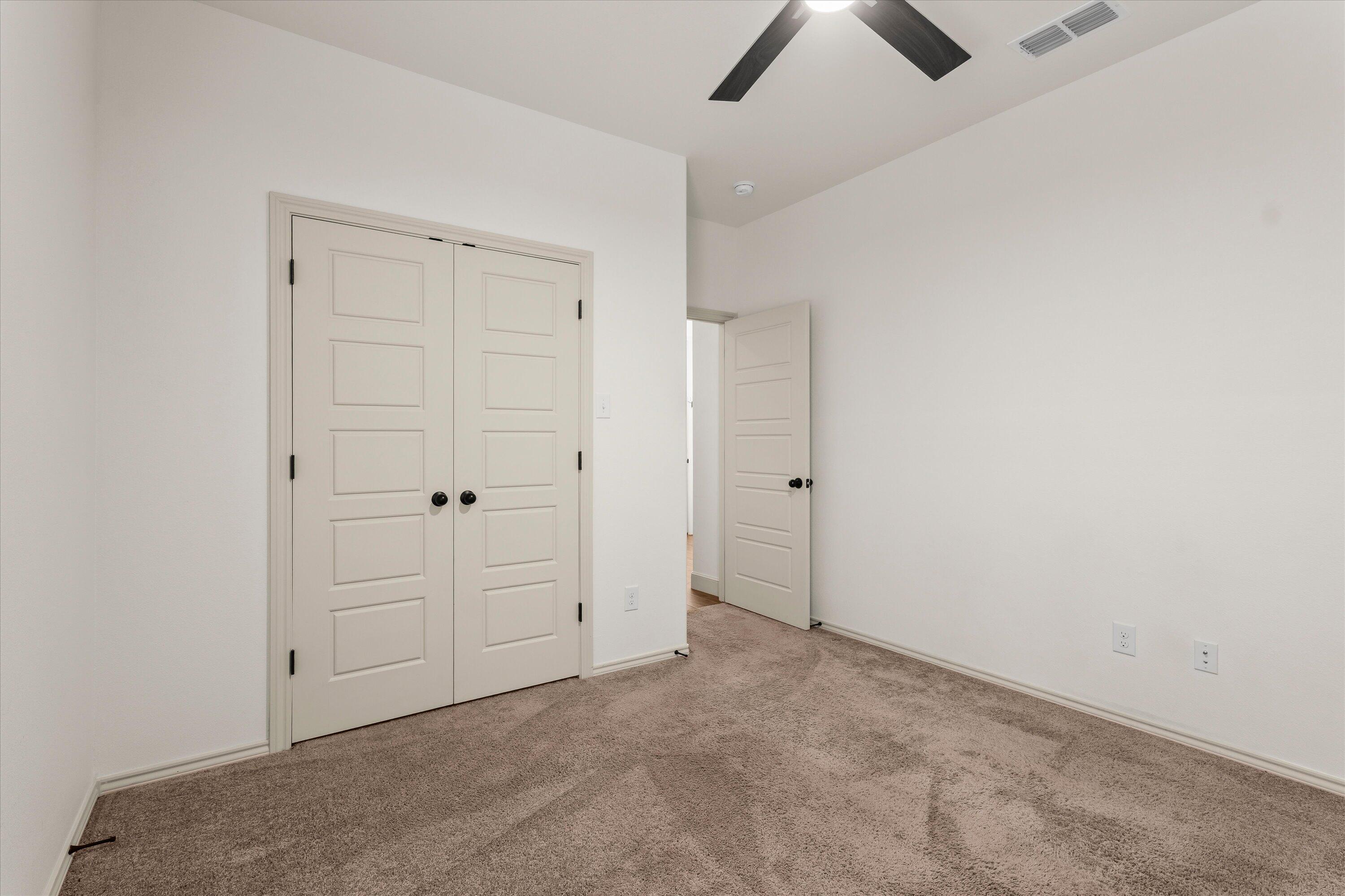5719 116th Street Lubbock, TX 79424 - Photo 24 of 31 an empty room with ceiling fan