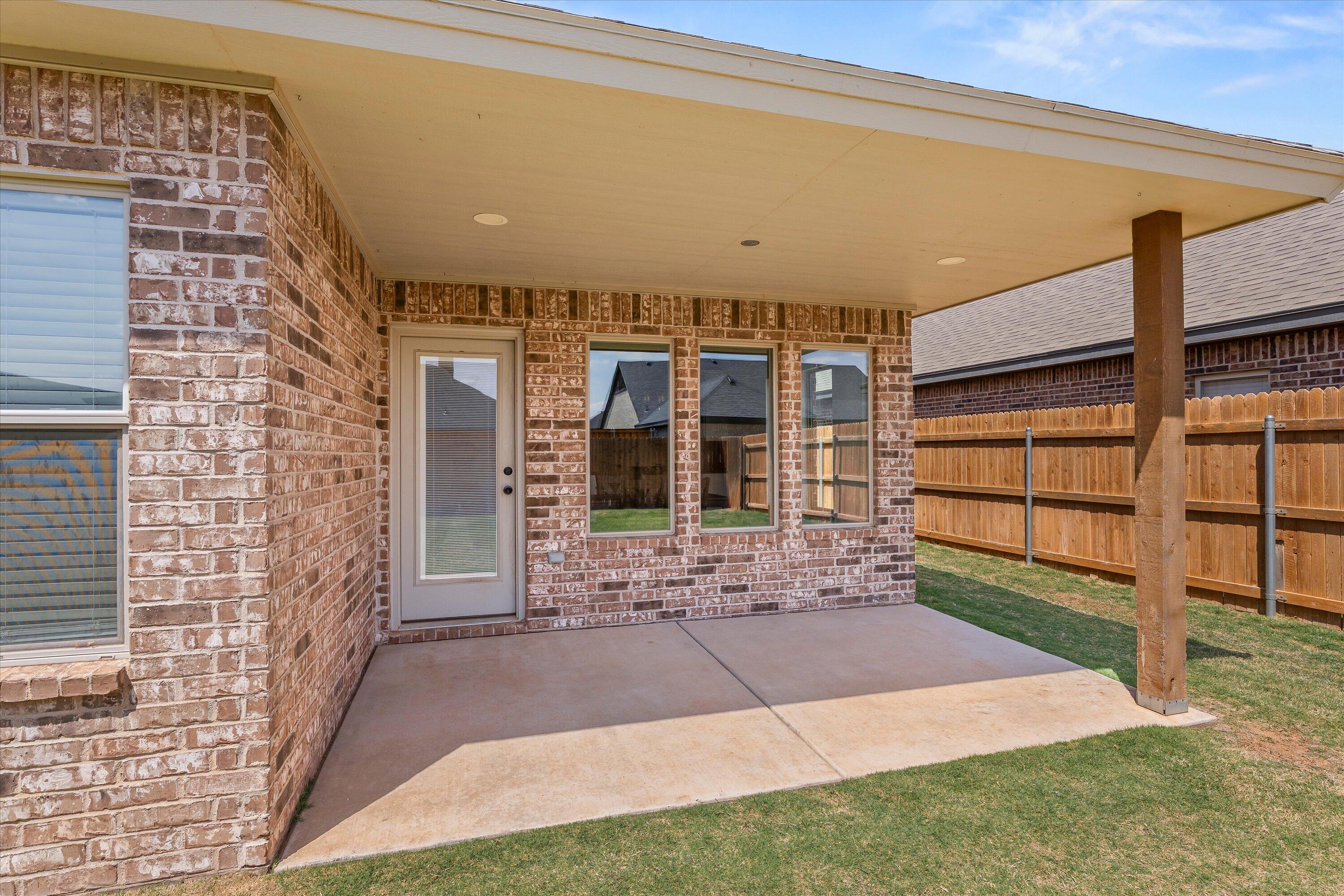 5719 116th Street Lubbock, TX 79424 - Photo 27 of 31 a view of front door of house and car parked