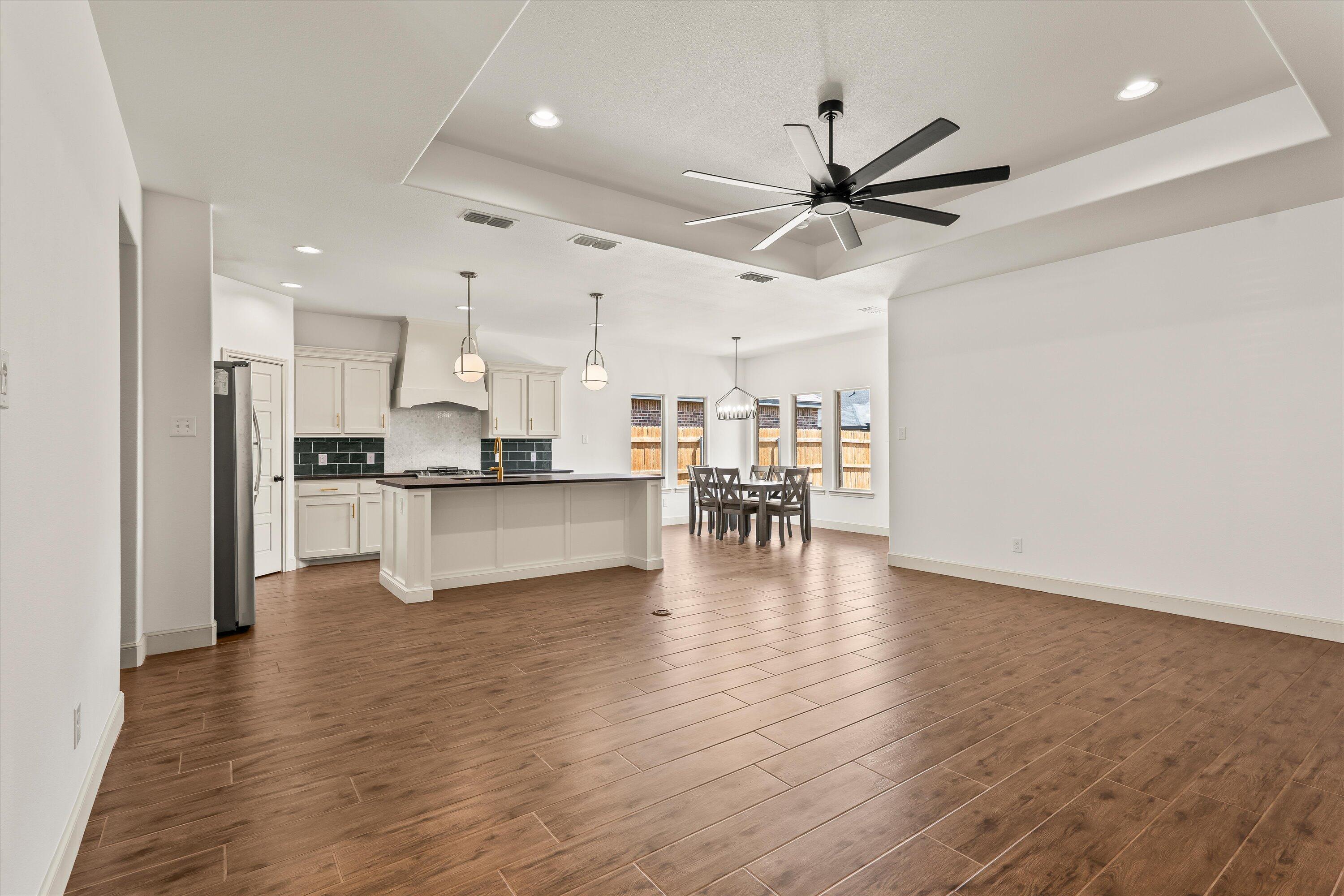 5719 116th Street Lubbock, TX 79424 - Photo 4 of 31 a view of kitchen with wooden floor