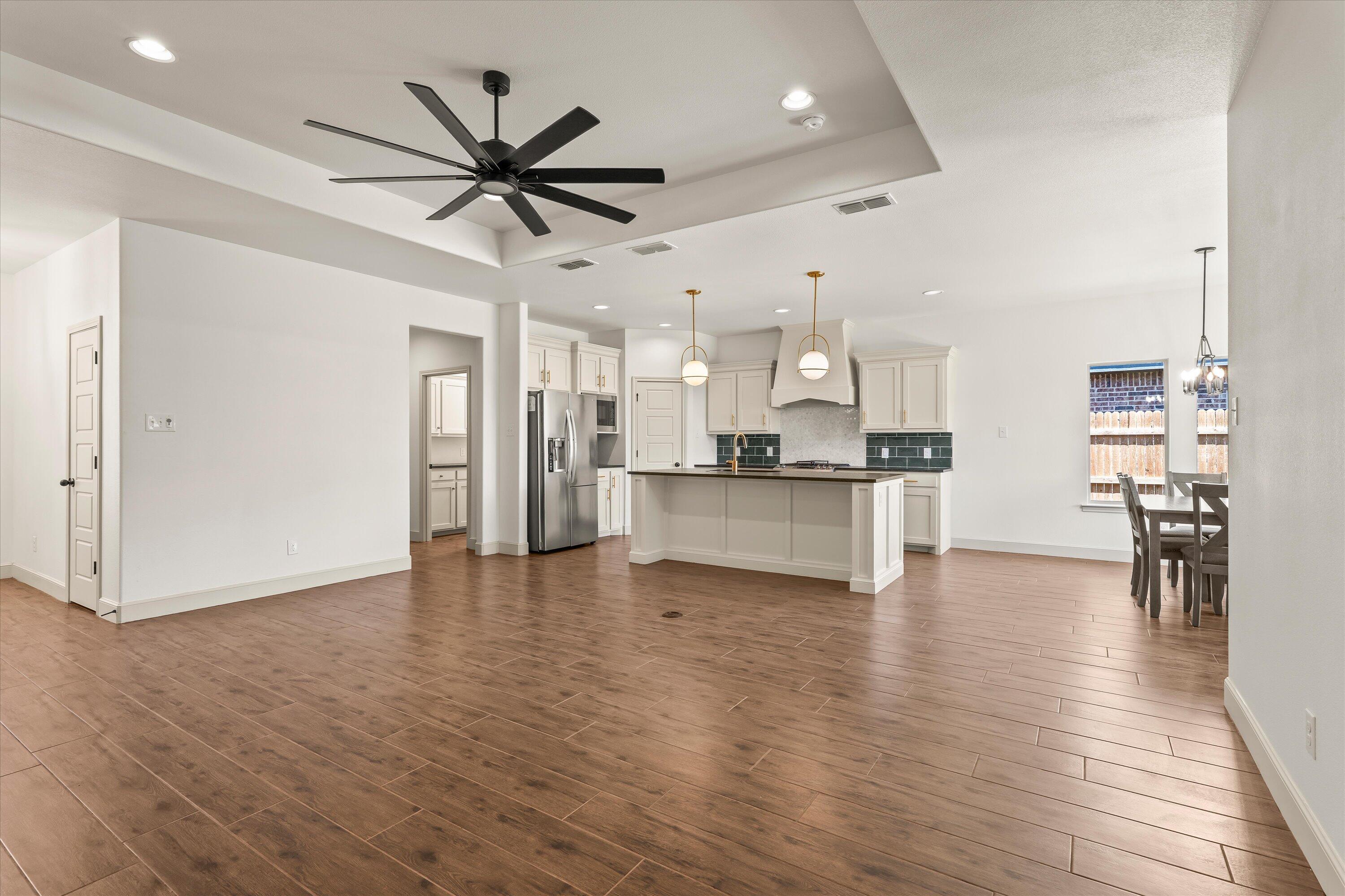 5719 116th Street Lubbock, TX 79424 - Photo 5 of 31 a view of kitchen with cabinets and stainless steel appliances