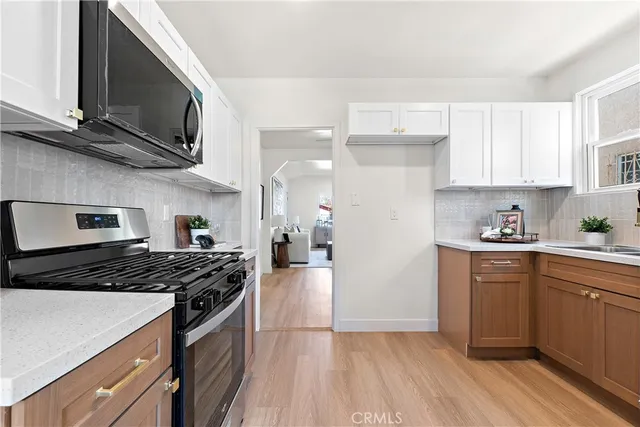 a kitchen with a stove and a refrigerator