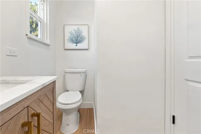 a bedroom with a bed and a potted plant