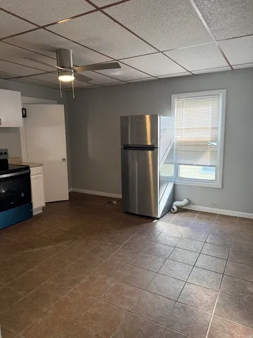 a view of a room with closet and windows
