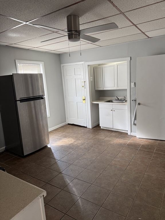 218 Vernon Street, Unit 2 Worcester, MA 01607 - Photo 10 of 19 a view of a kitchen with a sink and a refrigerator