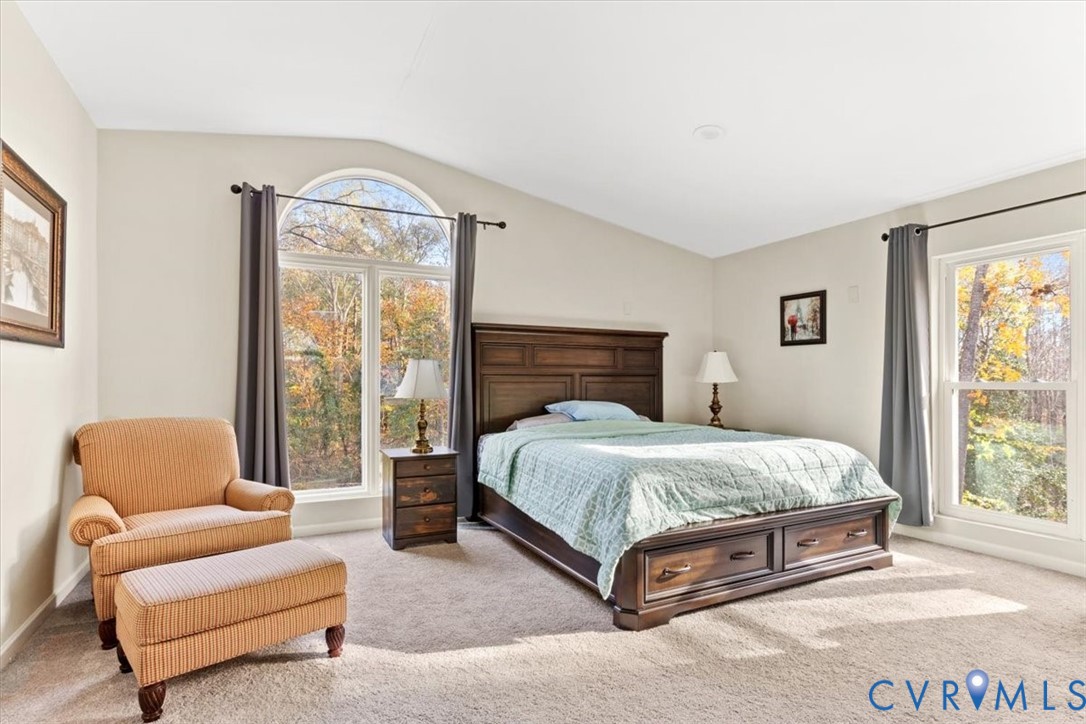 517 West Riverside Drive Lanexa, VA 23089 - Photo 4 of 27 a bedroom with a bed and a couch next to a window