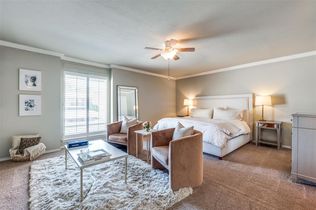 6353 Diamond Head Circle, Unit D Dallas, TX 75225 - Photo 18 of 25 a bedroom with a bed couch and wooden floor