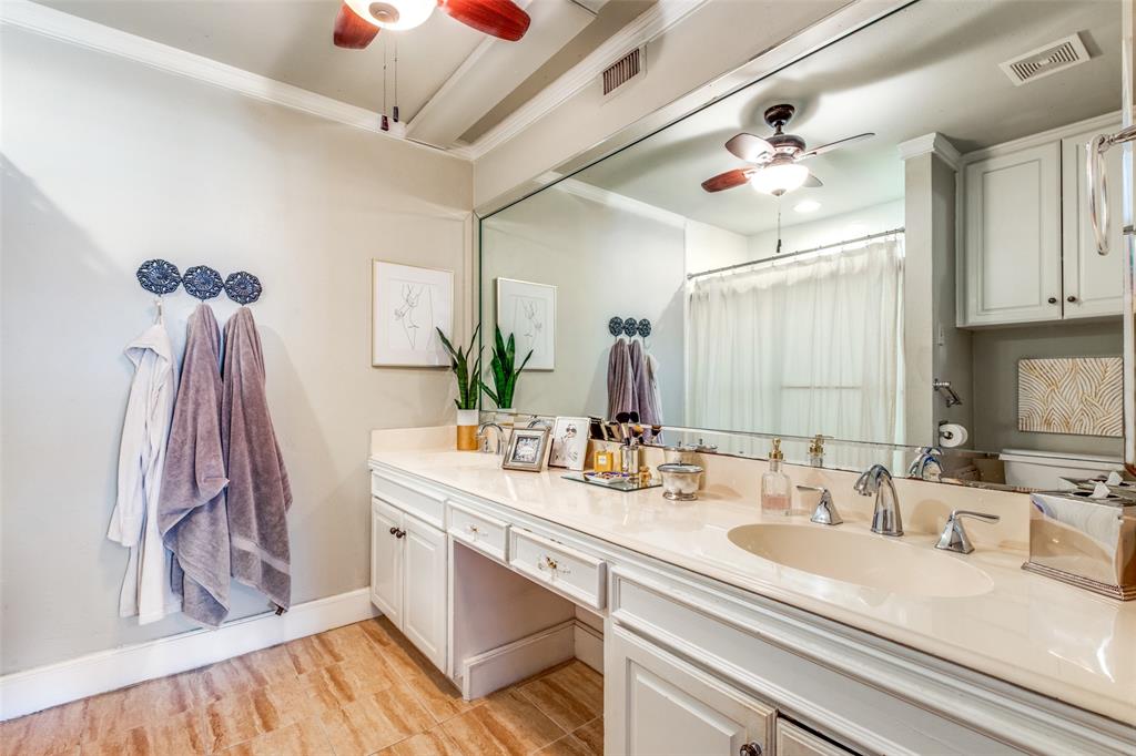 6353 Diamond Head Circle, Unit D Dallas, TX 75225 - Photo 19 of 25 a bathroom with a sink double vanity and mirror