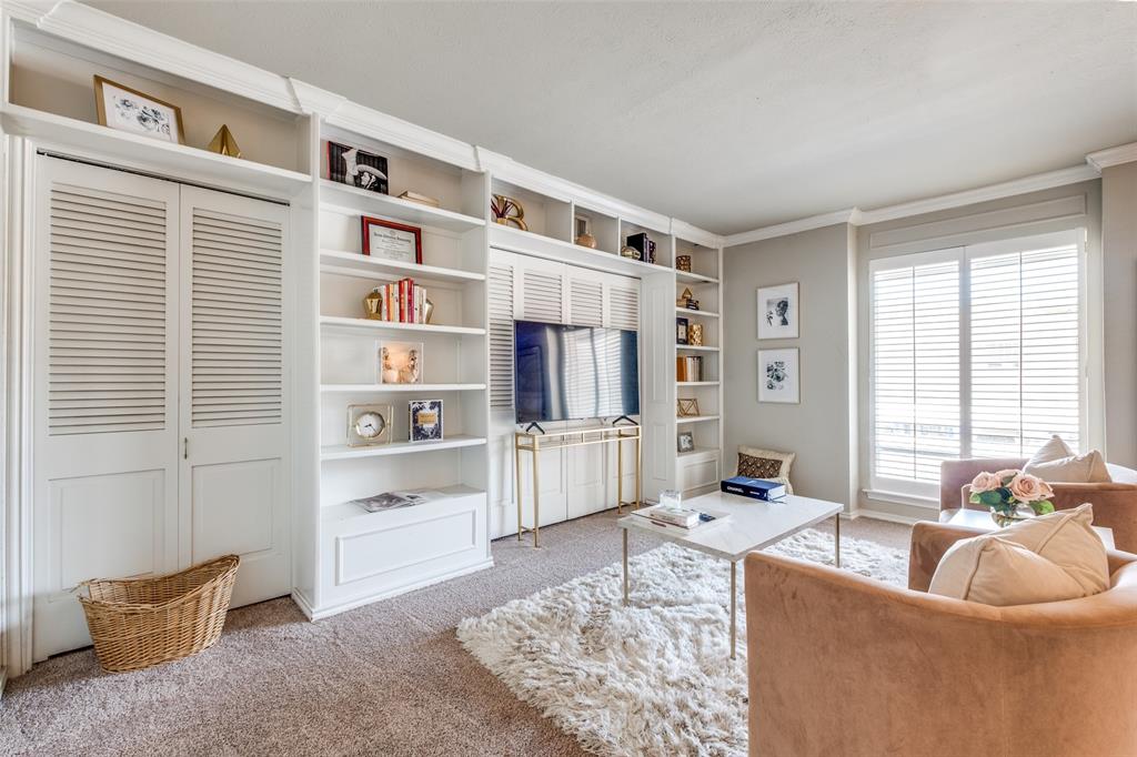 6353 Diamond Head Circle, Unit D Dallas, TX 75225 - Photo 21 of 25 a living room with furniture and a window