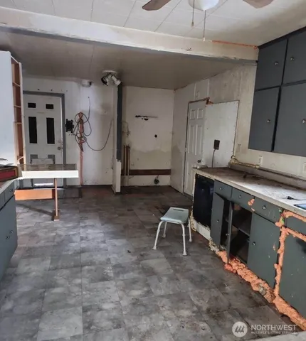 a room with gym equipment and view of living room