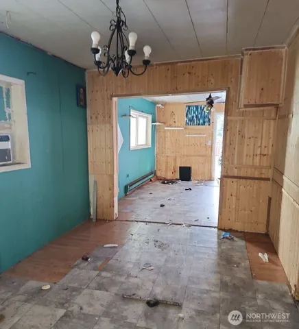 a view of a hallway with a chandelier