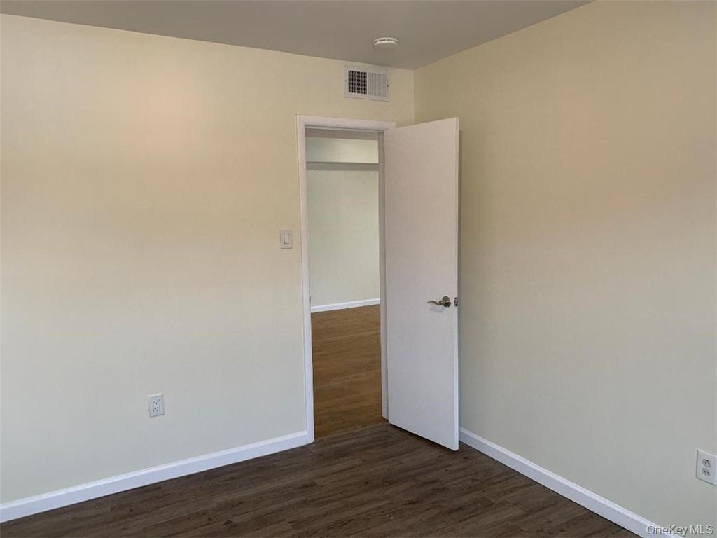 5273 Rte 9W, Unit NORTH Newburgh, NY 12550 - Photo 14 of 21 a view of an empty room with wooden floor