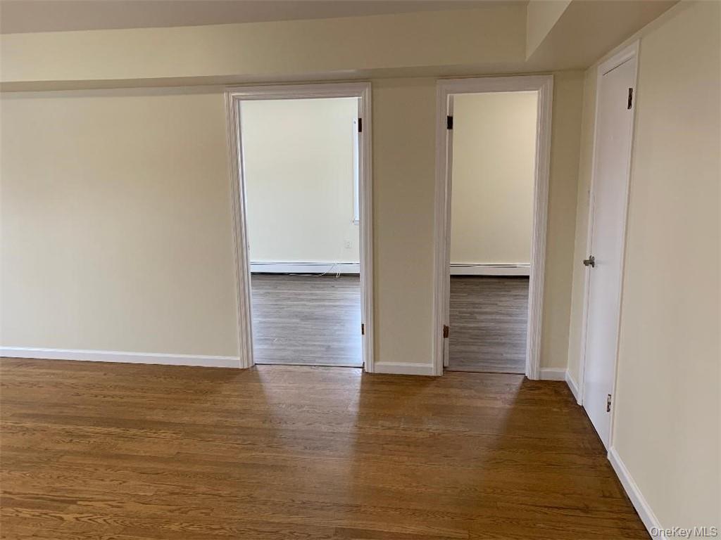 5273 Rte 9W, Unit NORTH Newburgh, NY 12550 - Photo 16 of 21 a view of an empty room with wooden floor