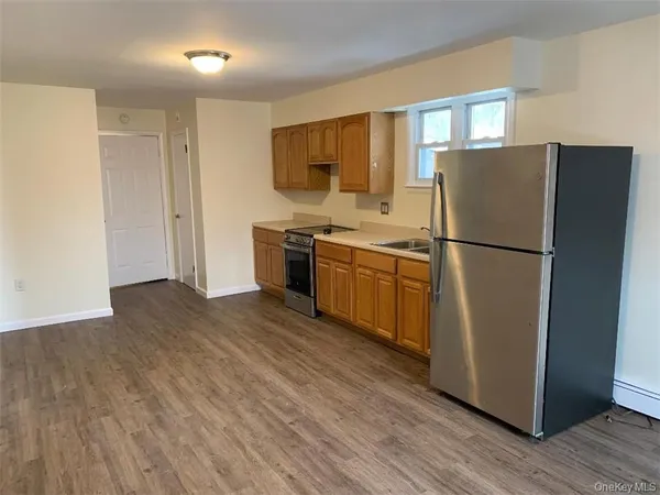 a kitchen with stainless steel appliances granite countertop a refrigerator stove a sink and dishwasher
