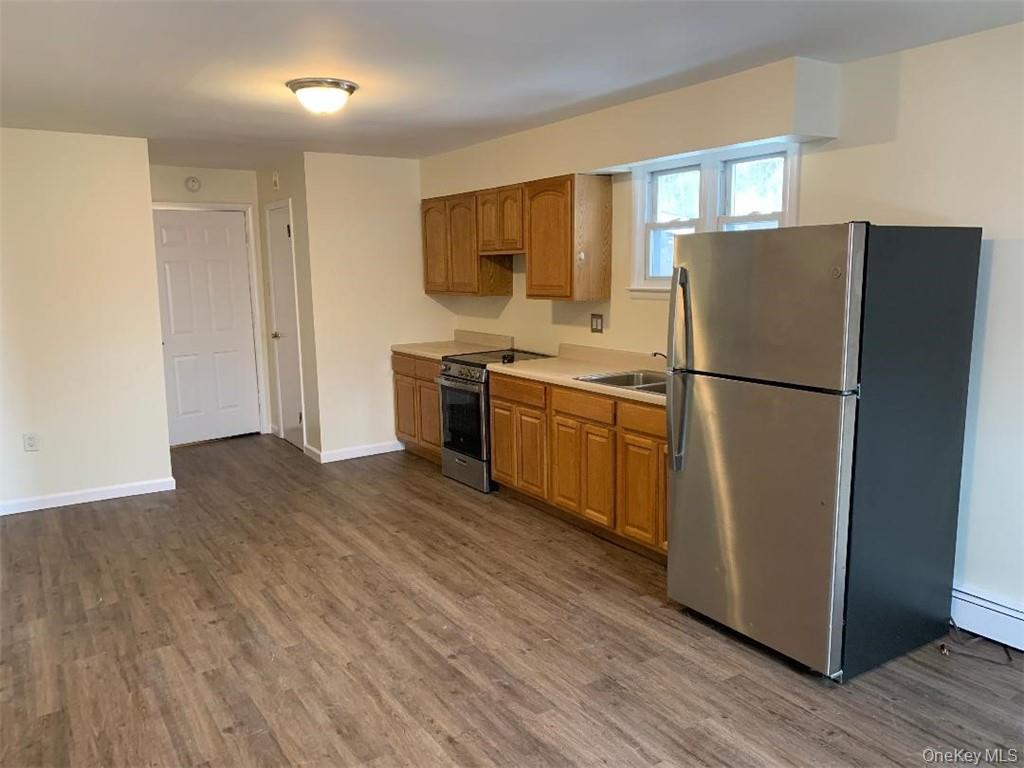 5273 Rte 9W, Unit NORTH Newburgh, NY 12550 - Photo 3 of 21 a kitchen with stainless steel appliances granite countertop a refrigerator stove a sink and dishwasher